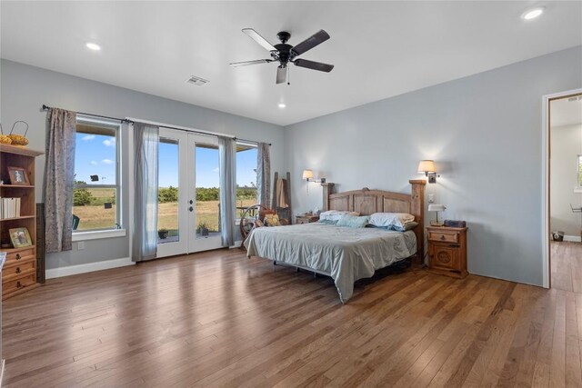 16508 Fm-973, Manor, TX 78653 - bedroom with access to exterior, hardwood / wood-style flooring, french doors, multiple windows, and recessed lighting