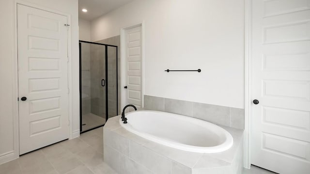 bathroom with tile patterned floors and plus walk in shower