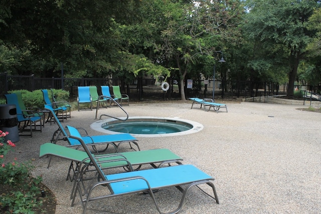 view of pool featuring a community hot tub