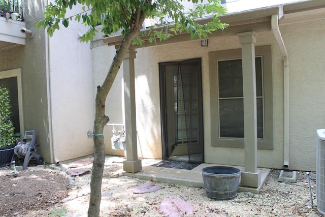 doorway to property with stucco siding