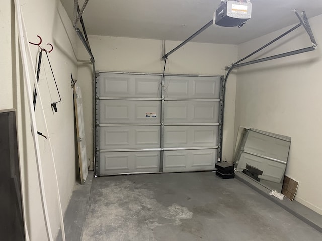 garage featuring a garage door opener