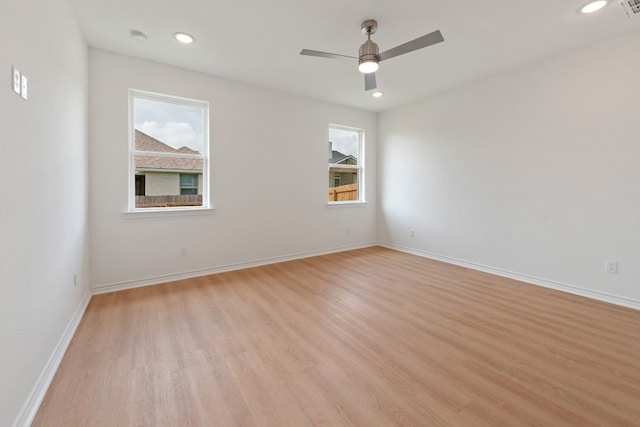 unfurnished room with ceiling fan and light hardwood / wood-style floors