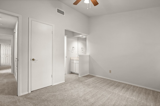 unfurnished bedroom featuring ceiling fan and light colored carpet