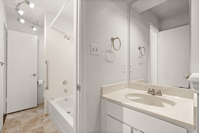 bathroom featuring vanity, tub / shower combination, and tile patterned floors