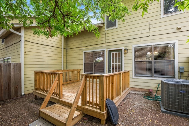 wooden terrace featuring central AC unit