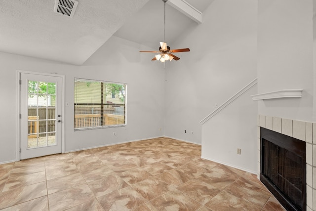 unfurnished living room featuring beam ceiling, light tile patterned floors, ceiling fan, and a tile fireplace