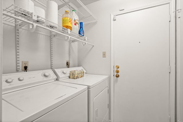 clothes washing area with independent washer and dryer