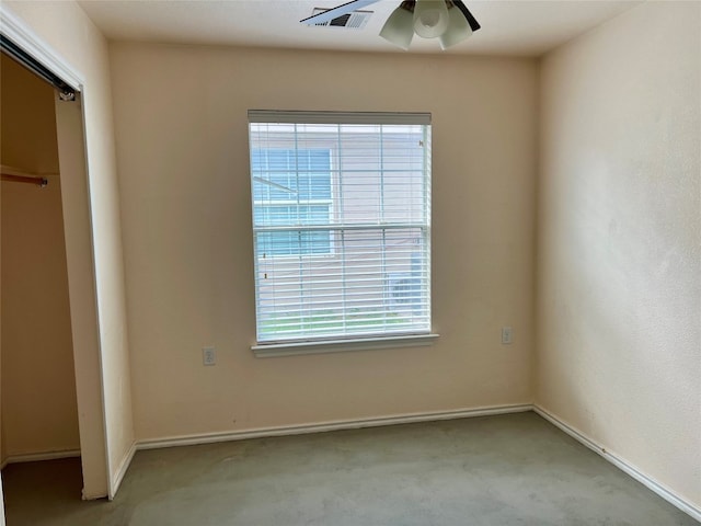 unfurnished bedroom featuring a closet, ceiling fan, and light colored carpet