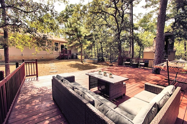 wooden deck with an outdoor living space