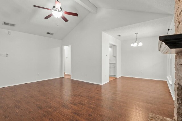 unfurnished living room with ceiling fan with notable chandelier, a fireplace, hardwood / wood-style floors, beam ceiling, and high vaulted ceiling