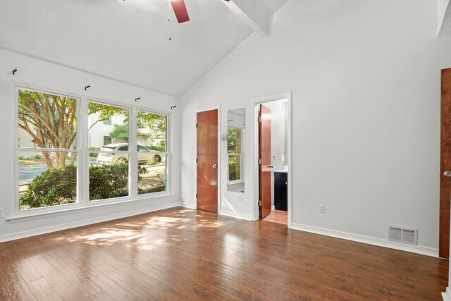 interior space featuring ensuite bath, high vaulted ceiling, beamed ceiling, dark wood-type flooring, and ceiling fan