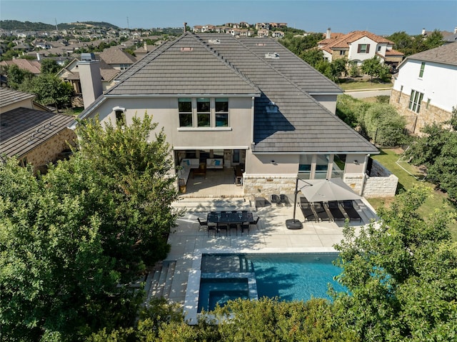 rear view of house featuring a patio area