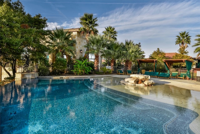 view of swimming pool with a patio area and a gazebo