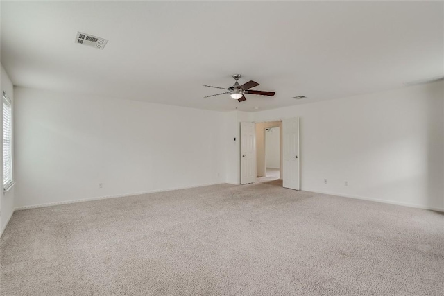 360 Wildhorse Crk, Buda, TX 78610 - unfurnished room with a ceiling fan, light carpet, and baseboards
