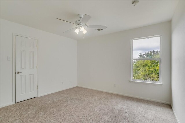 unfurnished room featuring ceiling fan and light colored carpet