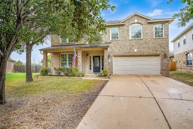 view of front facade featuring a front yard, a garage, and a porch