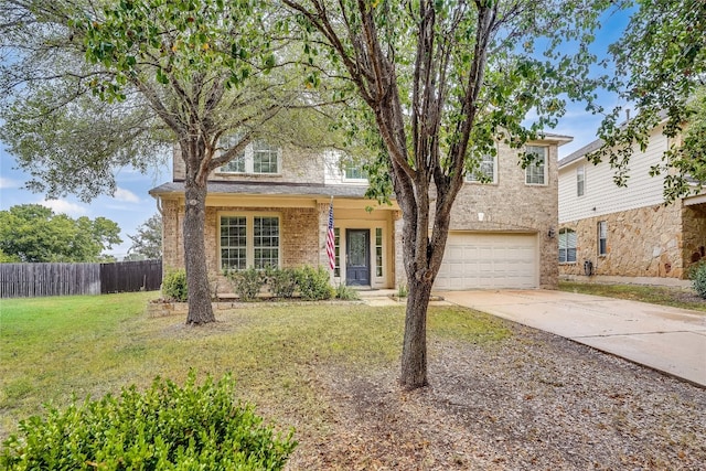 view of front of house featuring a front yard and a garage