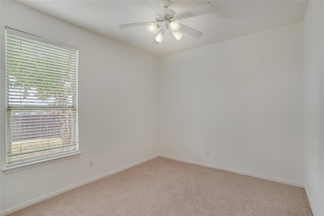 360 Wildhorse Crk, Buda, TX 78610 - unfurnished room with carpet floors, plenty of natural light, and ceiling fan
