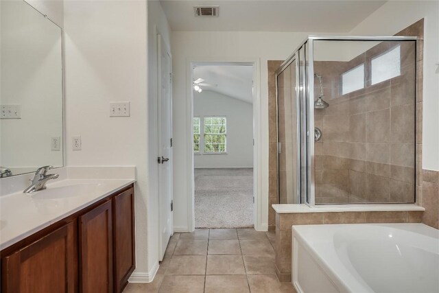 bathroom featuring shower with separate bathtub, lofted ceiling, tile patterned floors, ceiling fan, and vanity