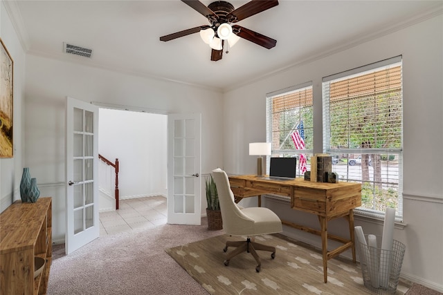 carpeted home office featuring french doors, ornamental molding, and ceiling fan