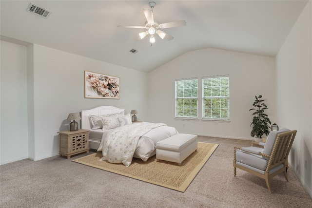 carpeted bedroom featuring ceiling fan and vaulted ceiling