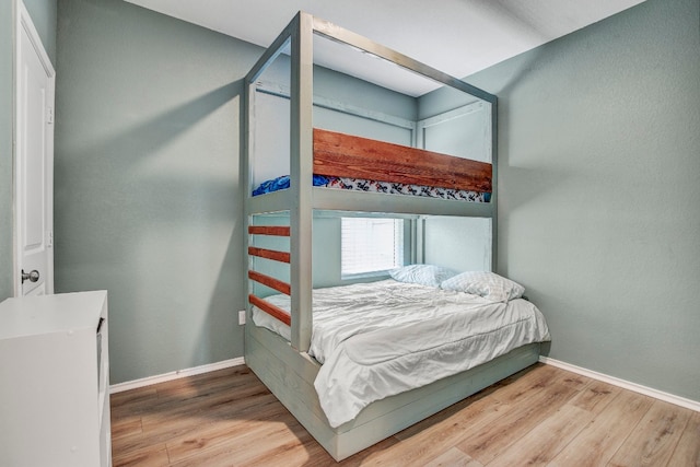 bedroom with light hardwood / wood-style flooring