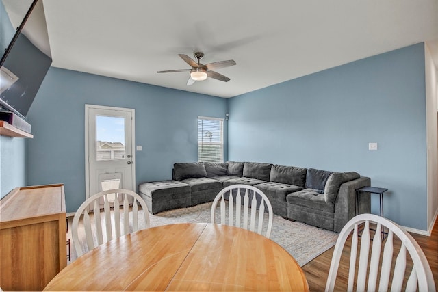 dining room with hardwood / wood-style floors and ceiling fan