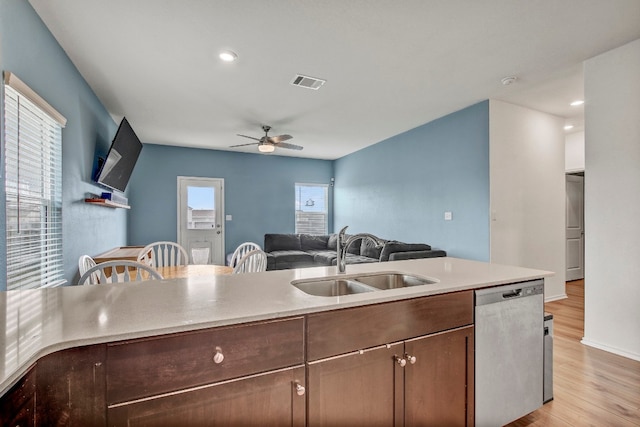 kitchen with dishwasher, light wood-type flooring, sink, and ceiling fan