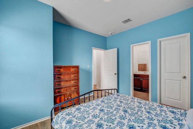 bedroom featuring hardwood / wood-style flooring