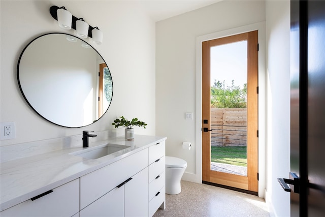 bathroom with vanity and toilet