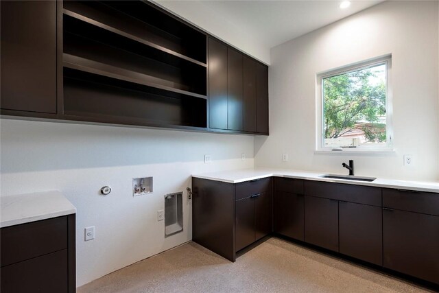 kitchen with sink and dark brown cabinetry