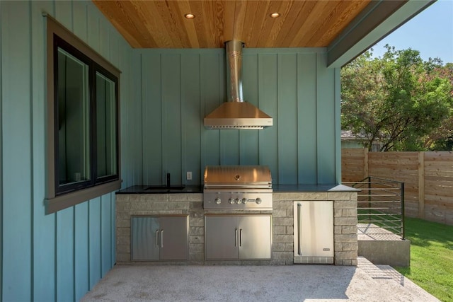 view of patio / terrace with a sink, fence, and area for grilling