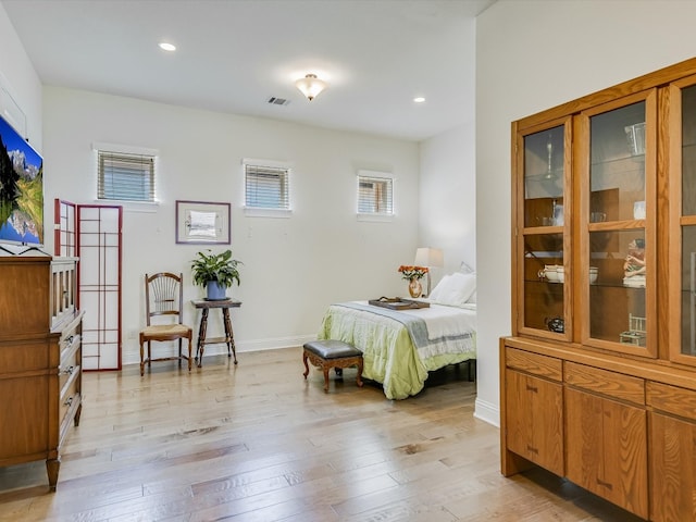 bedroom with light hardwood / wood-style floors