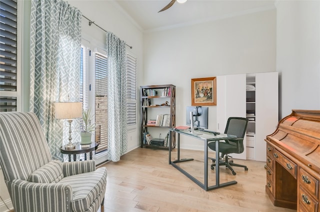 office with crown molding, light hardwood / wood-style flooring, and ceiling fan