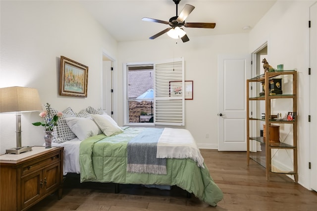 bedroom featuring ceiling fan and dark wood-type flooring