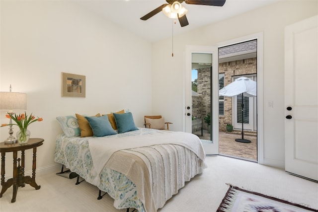 bedroom with access to exterior, ceiling fan, and light carpet