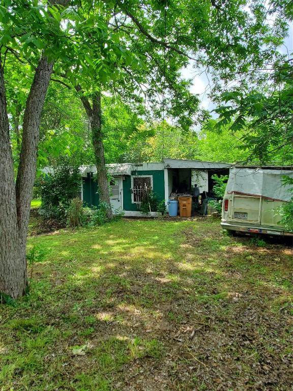 5512 Joe Sayers Ave, Austin, TX 78756 - view of green lawn featuring an outbuilding