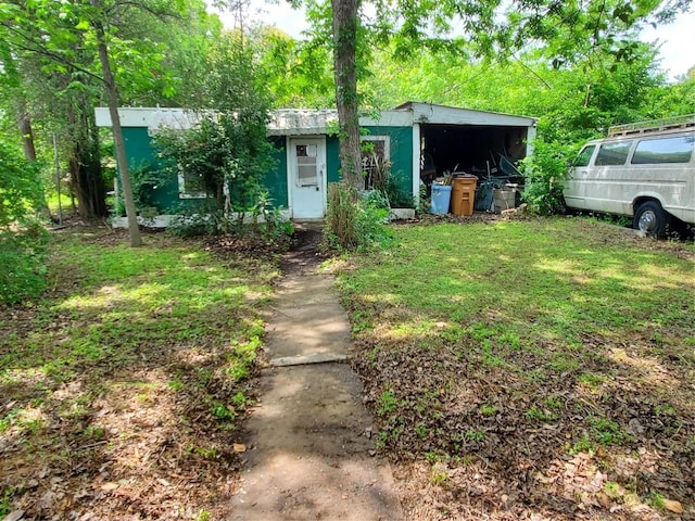 view of front of home featuring an outbuilding