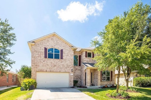 view of front of house featuring a garage and a front yard