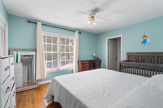 bedroom featuring ceiling fan and wood-type flooring