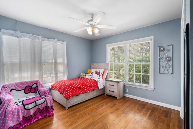 bedroom featuring dark wood-type flooring and ceiling fan