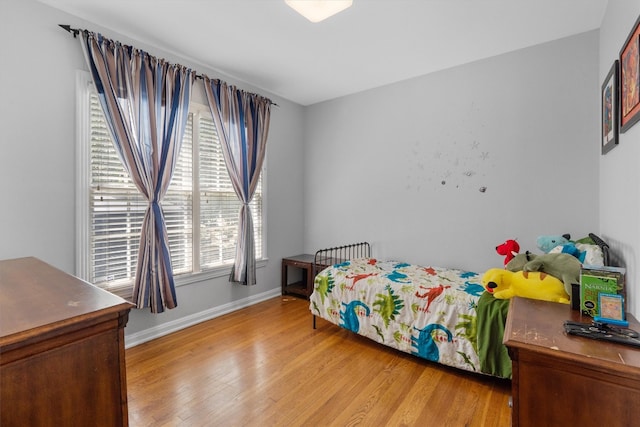 bedroom with light hardwood / wood-style floors