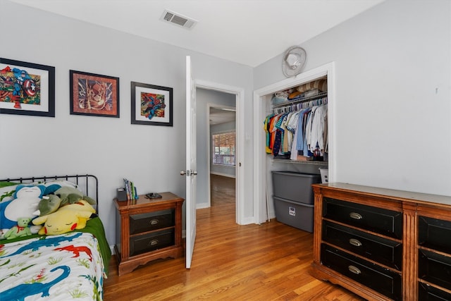 bedroom with a closet and light wood-type flooring