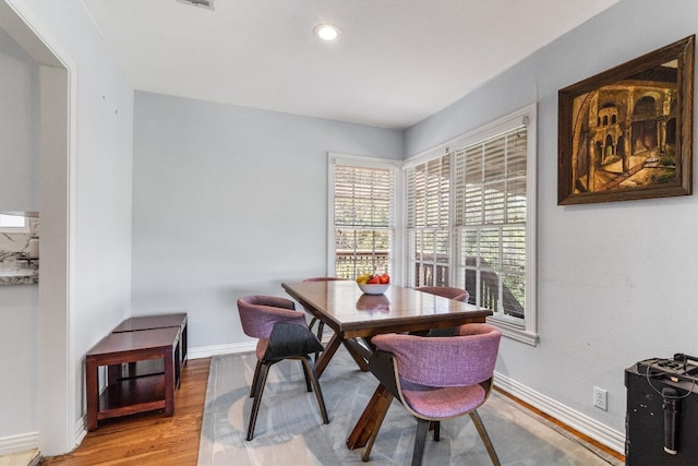 dining area with hardwood / wood-style flooring