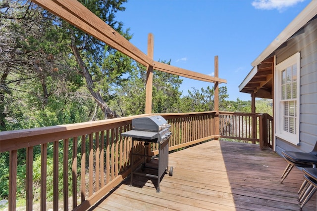 wooden terrace with a grill