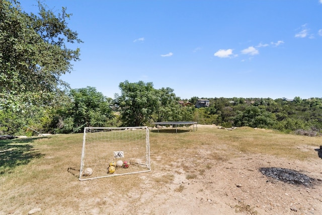 view of yard featuring a trampoline