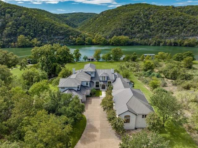 drone / aerial view featuring a water and mountain view