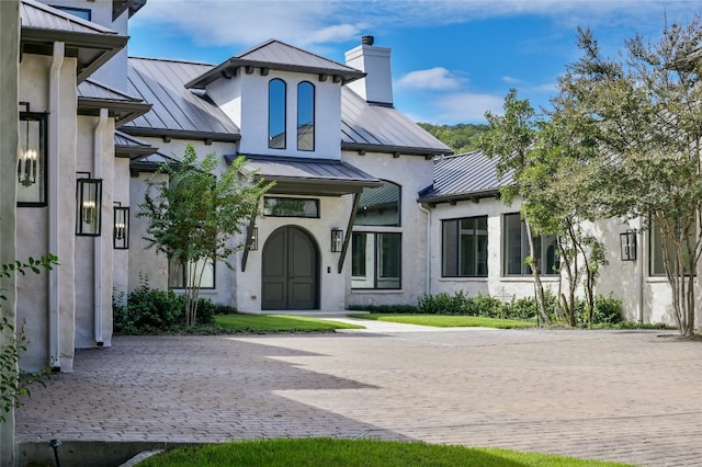 13414 Shore Vista Dr, Austin, TX 78732 - view of front of home featuring a standing seam roof, a metal roof, and stucco siding