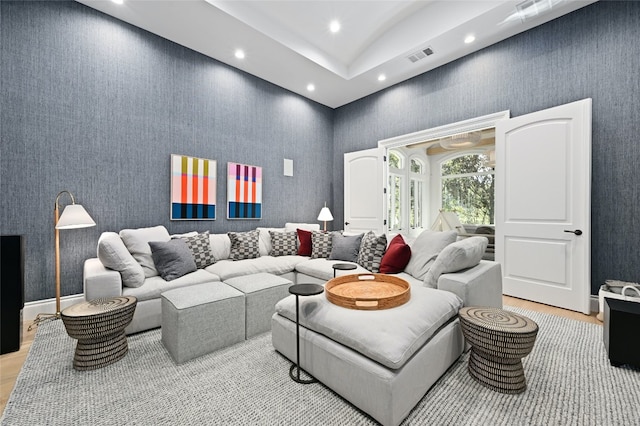 living room with a towering ceiling