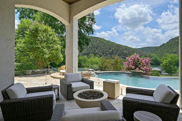 13414 Shore Vista Dr, Austin, TX 78732 - view of swimming pool with a patio, a mountain view, a pool with connected hot tub, and a forest view